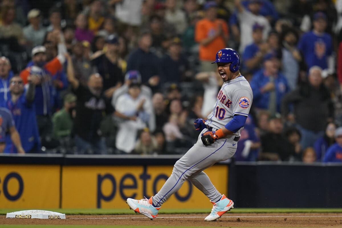 New York Mets' Eduardo Escobar reacts after hitting a two-RBI triple during the ninth inning of a baseball game against the San Diego Padres, Monday, June 6, 2022, in San Diego. (AP Photo/Gregory Bull)