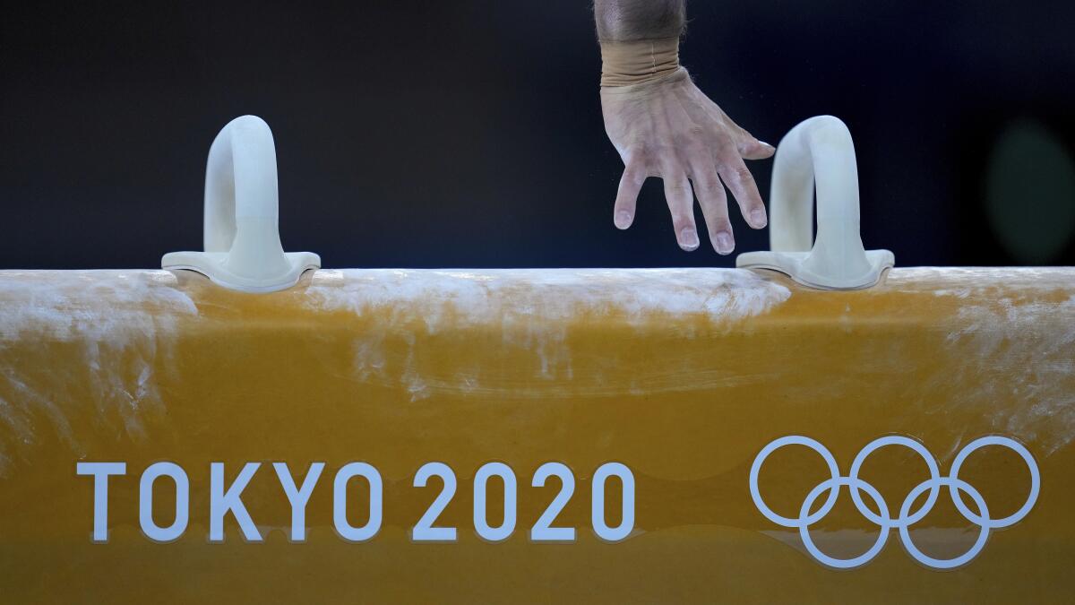 New Zealand's Mikhail Koudinov trains on the pommel horse on Wednesday.