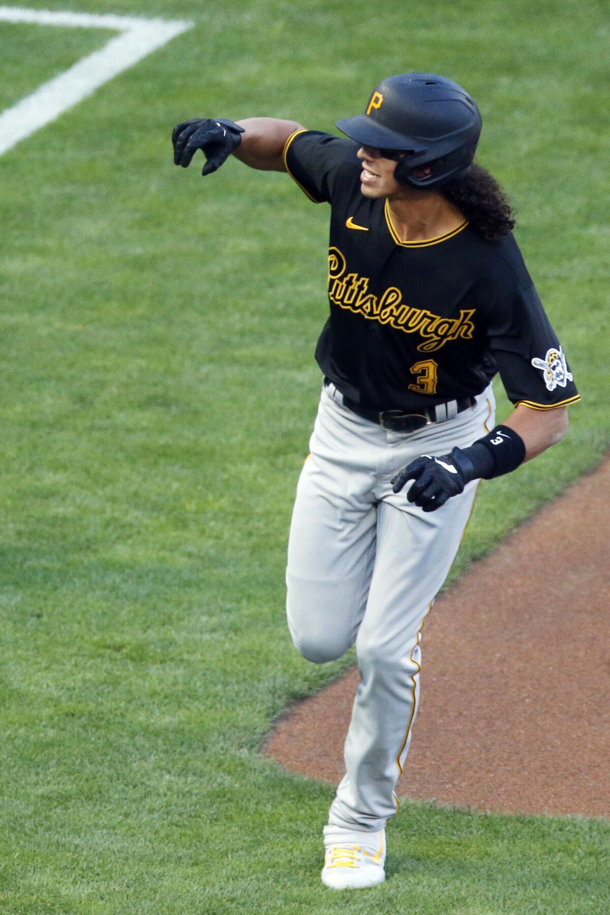 Pittsburgh Pirates' Cole Tucker runs the bases on a solo home run off Minnesota Twins pitcher Lewis Thorpe during the first inning of a baseball game Monday, Aug. 3, 2020, in Minneapolis. (AP Photo/Jim Mone)