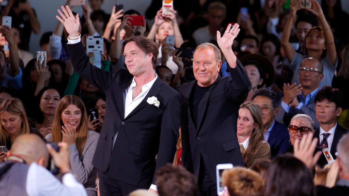 Musician Rufus Wainwright, left, with Michael Kors at the fashion designer's spring 2017 runway show on Sept. 14.