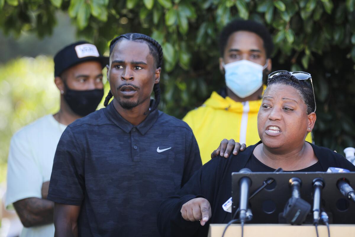 Amaurie Johnson, left, with activist Tasha Williamson. 