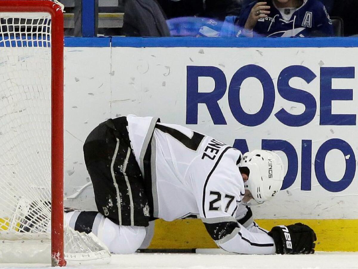 Kings defenseman Alec Martinez is day to day because of concussion-like symptoms after a big hit from Lightning center Cedric Paquette.