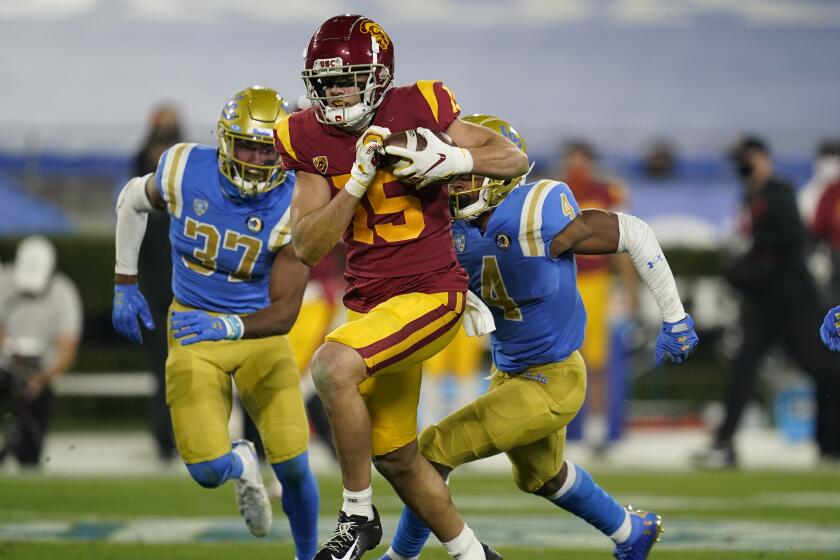 USC wide receiver Drake London runs to the end zone on a 65-yard touchdown against UCLA on Dec. 12, 2020.