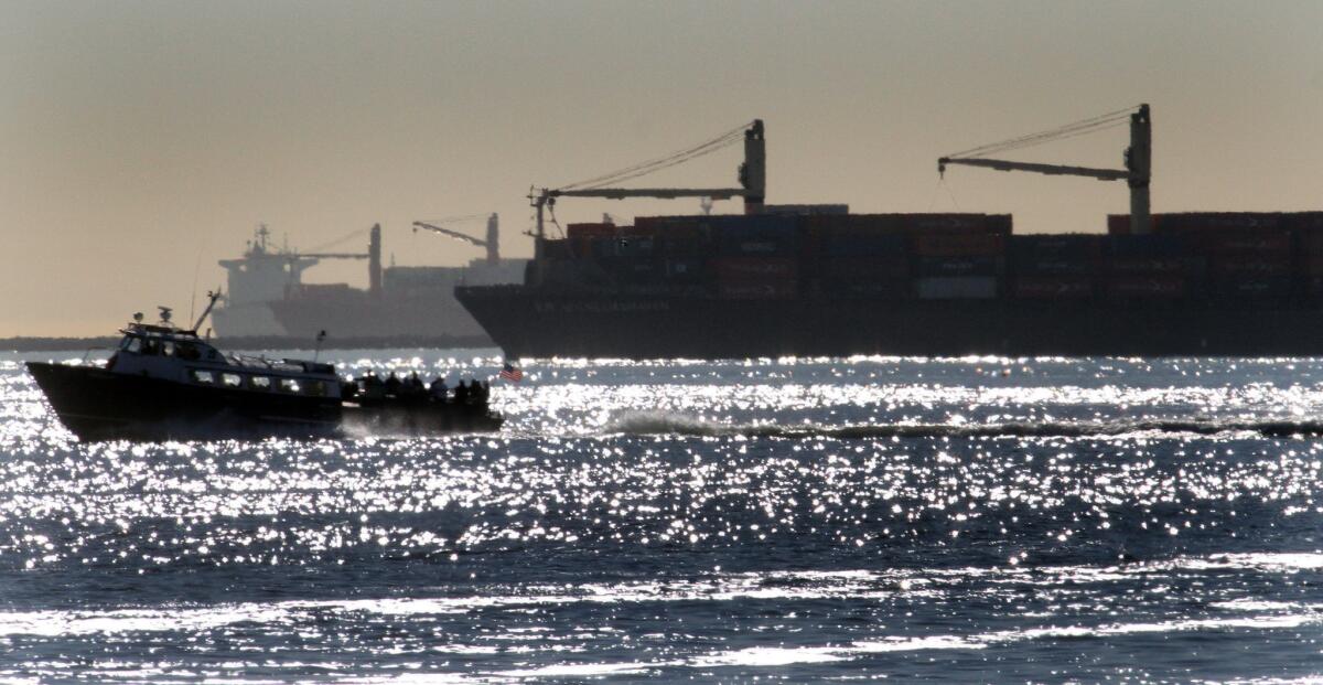 Container ships wait offshore to get into the Port of Long Beach on Feb. 11.