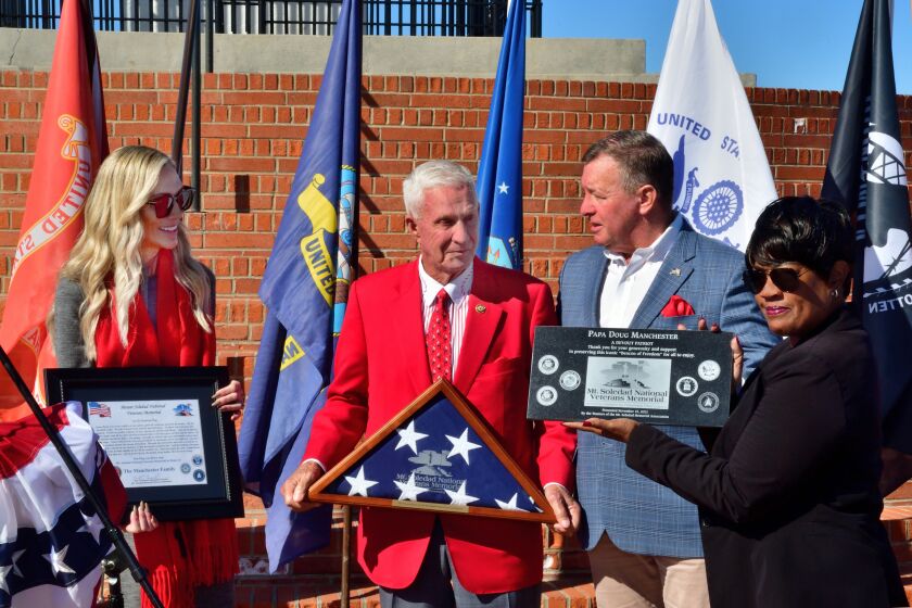 "Papa" Doug Manchester (center) is honored at a ceremony at the Mount Soledad National Veterans Memorial.