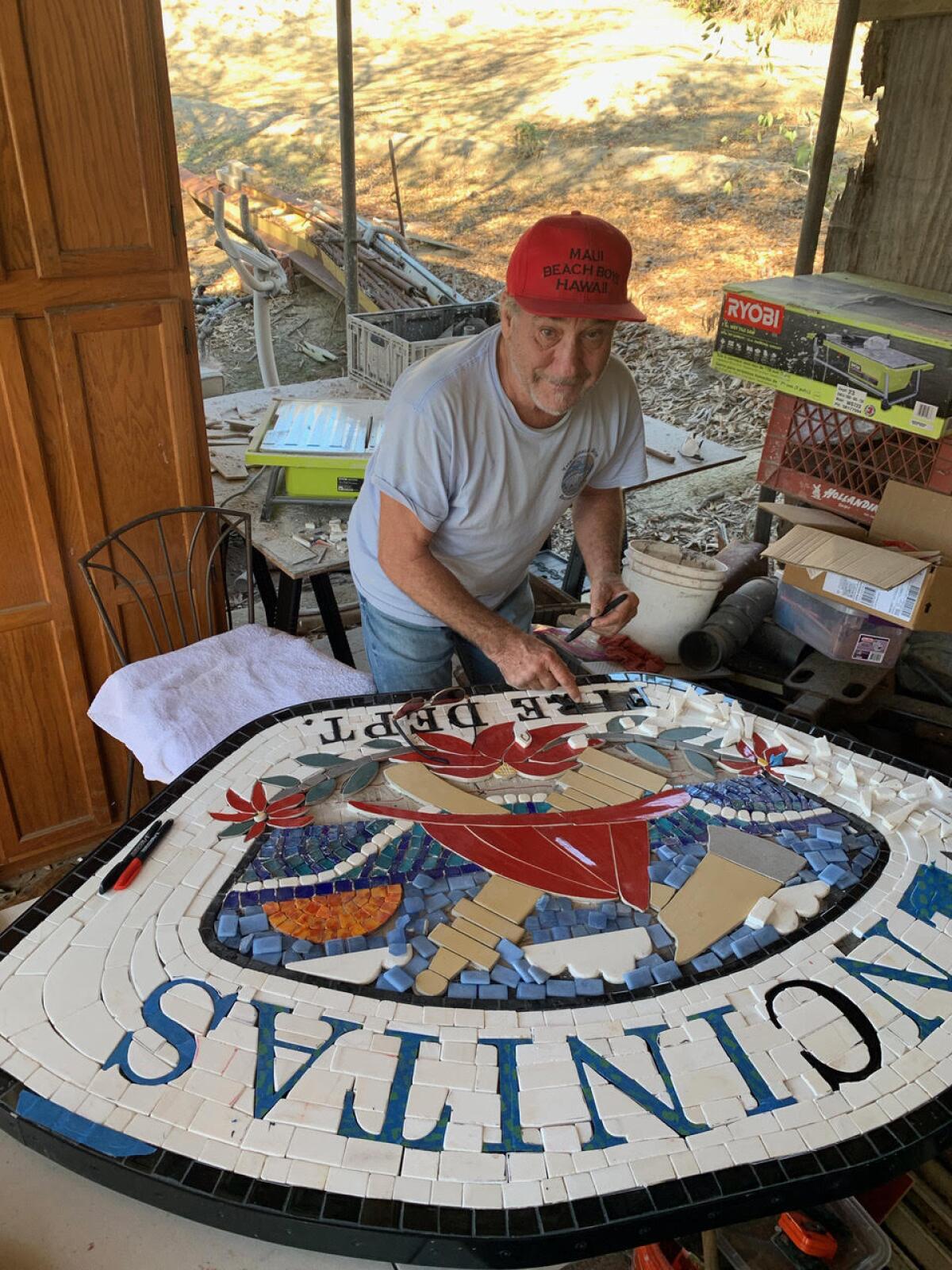 Terry Weaver working on a mosaic.
