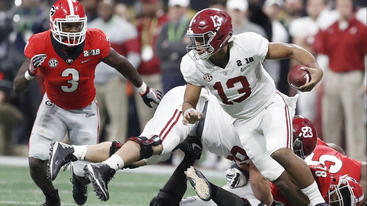 Alabama quarterback Tua Tagovailoa runs during the second half of the College Football Playoff championship game against Georgia in Atlanta on Jan. 8. The two teams will meet this Saturday in the Southeastern Conference championship.