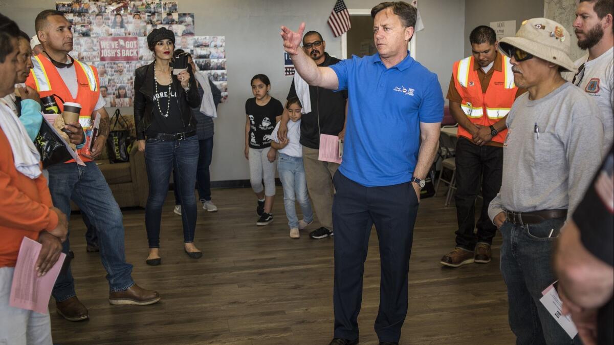 State Sen. Josh Newman, shown with his supporters Saturday, has been targeted by Republicans for his support of raising California's gas tax.