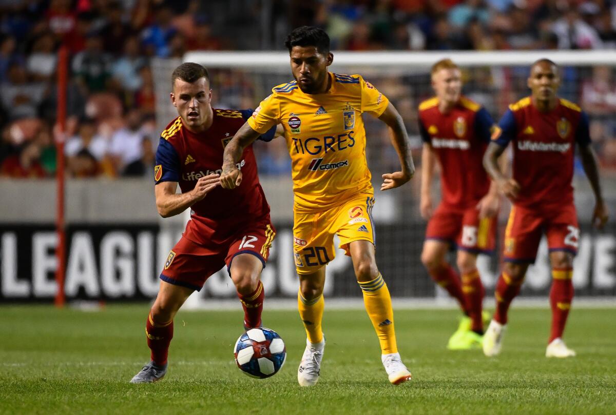 SANDY, UT - JULY 24: Javier Aquino #20 of UANL Tigres drives past Brooks Lennon #12 of Real Salt Lake during a quarterfinals match as part of the Leagues Cup 2019 at Rio Tinto Stadium on July 24, 2019 in Sandy, Utah. (Photo by Alex Goodlett/Getty Images) ** OUTS - ELSENT, FPG, CM - OUTS * NM, PH, VA if sourced by CT, LA or MoD **