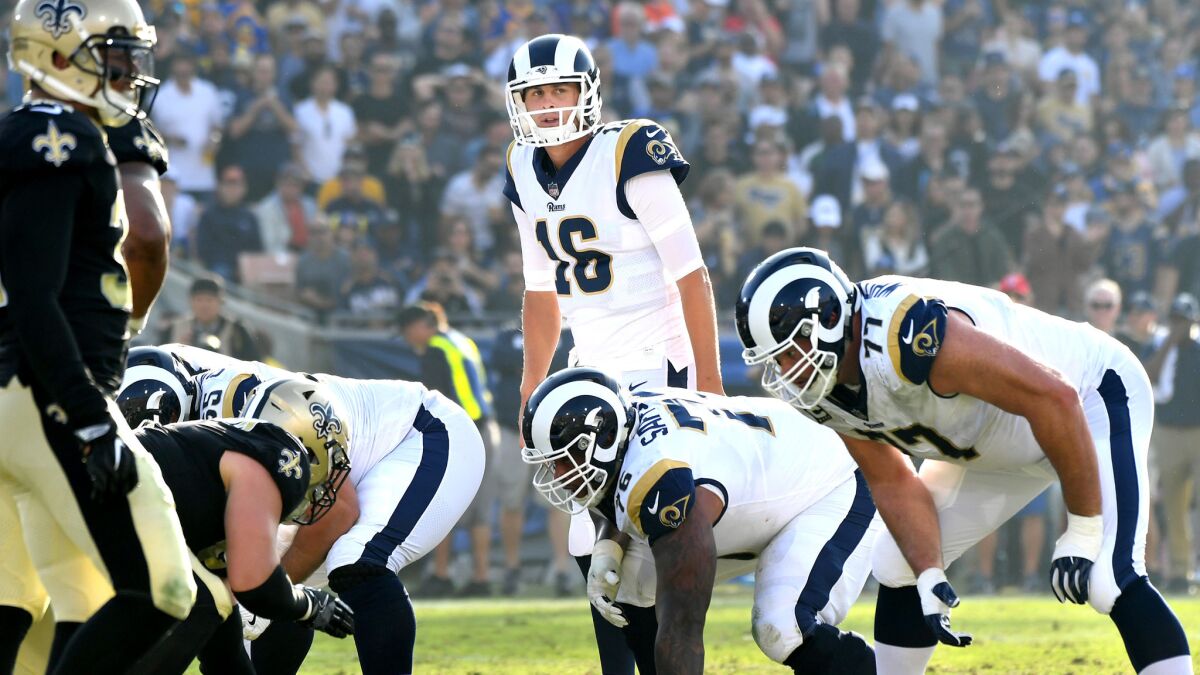 Rams quarterback Jared Goff surveys the Saints defense before calling a play at the line of scrimmage on Sunday.