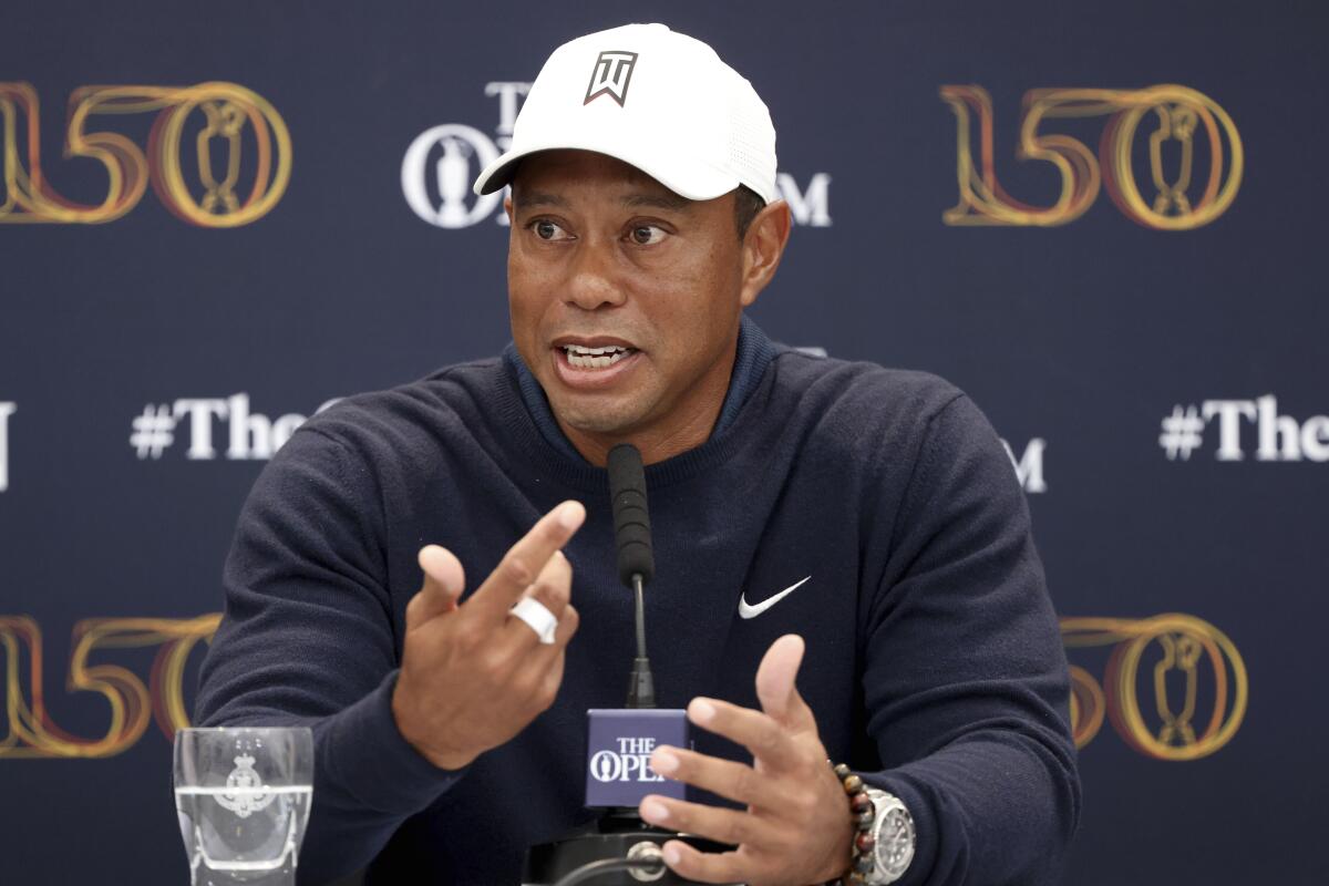 Golfer Tiger Woods speaks during a news conference 