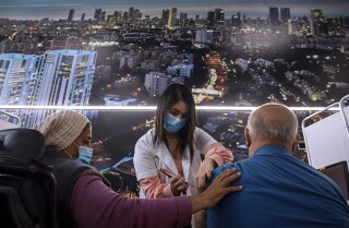An Israeli man receives a COVID-19 vaccine in Tel Aviv.