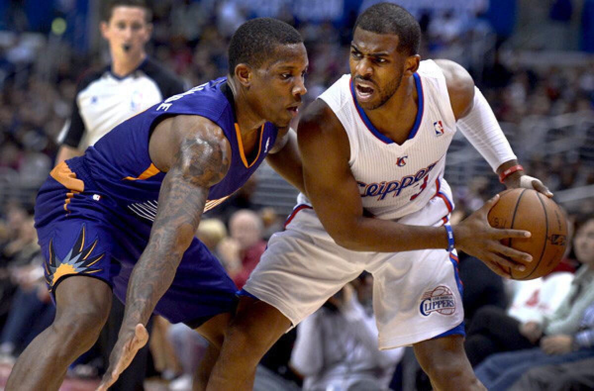 Clippers point guard Chris Paul is closely guarded by former teammate and Suns point guard Eric Bledsoe during a game earlier this season at Staples Center.