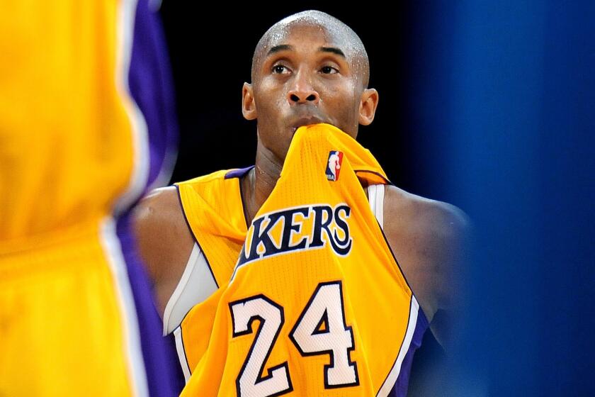 Lakers star Kobe Bryant looks on during a game against the New Orleans Hornets at Staples Center on Jan. 29, 2013.