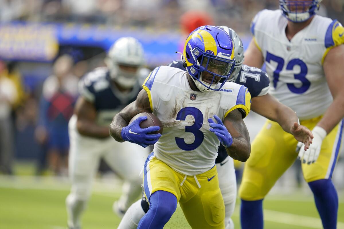 The Rams' Cam Akers carries the football against the Dallas Cowboys.