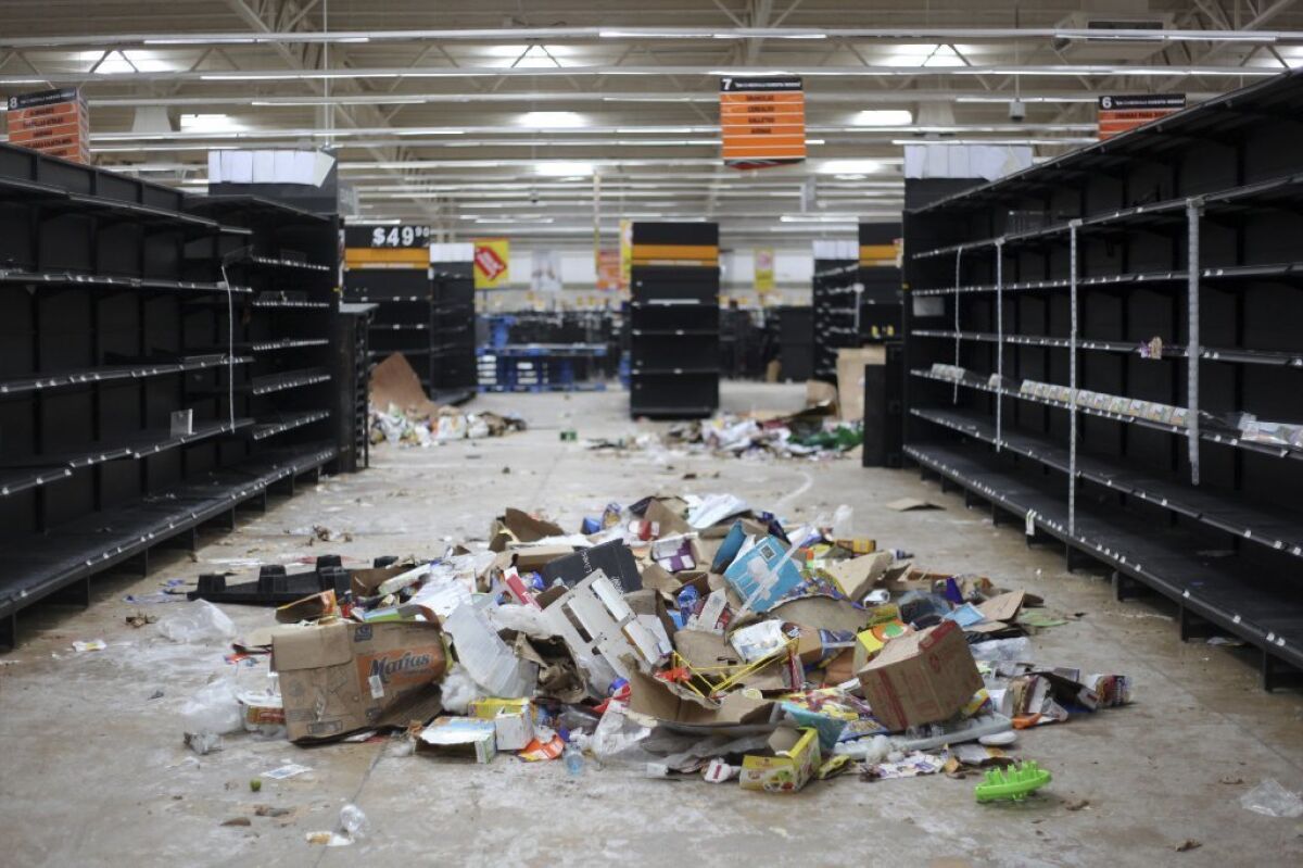 Supermarket displays stand empty after looting Jan. 7 that followed a 20% hike in gasoline prices in Veracruz, Mexico.