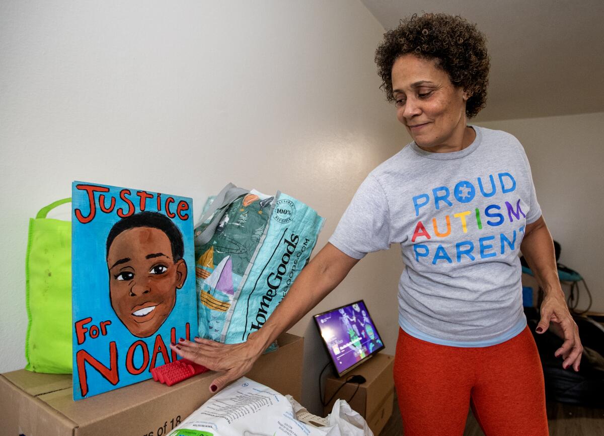 Christine LyBurtus looks at a drawing of her son, Noah