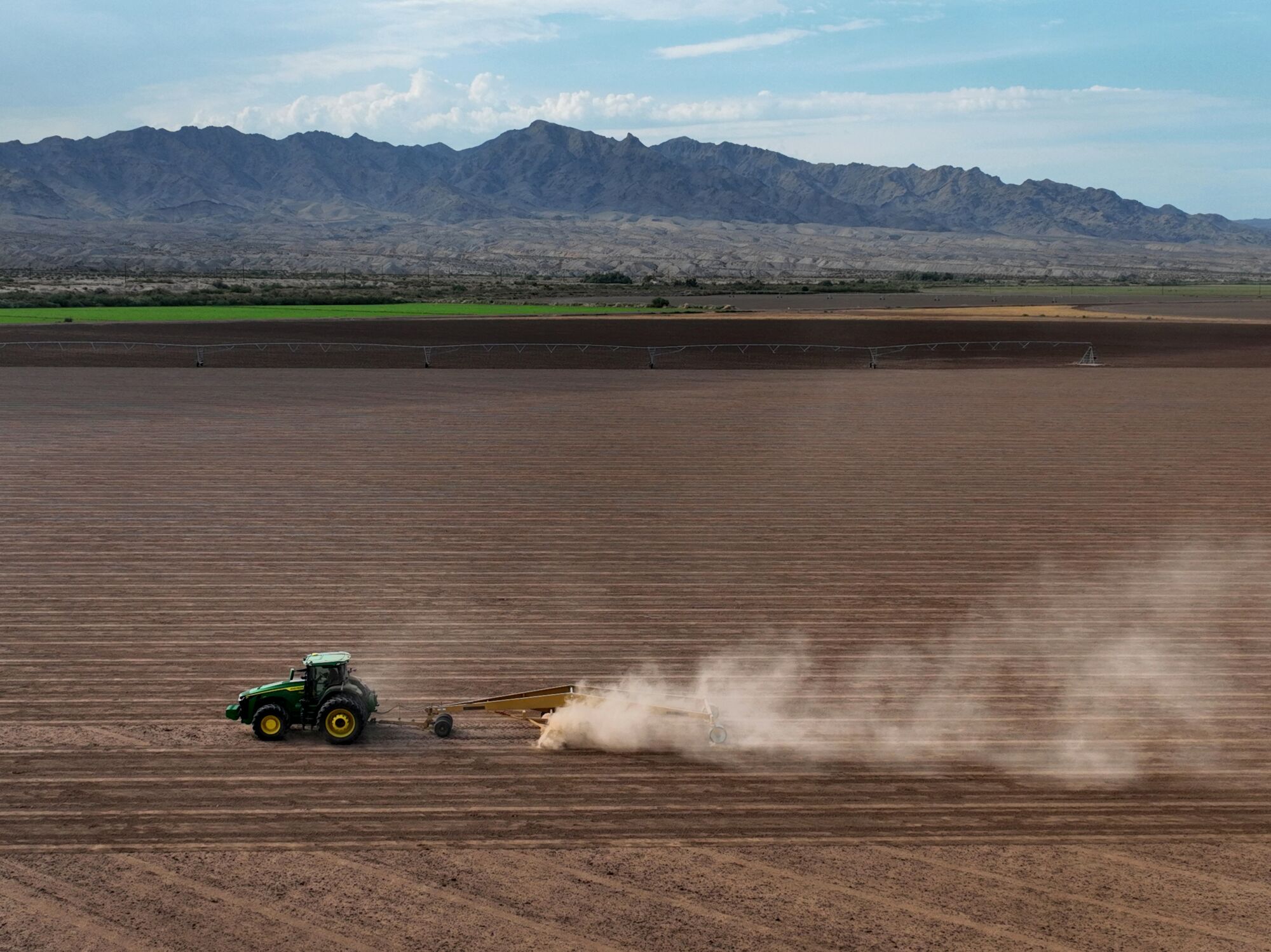 A tractor prepares land