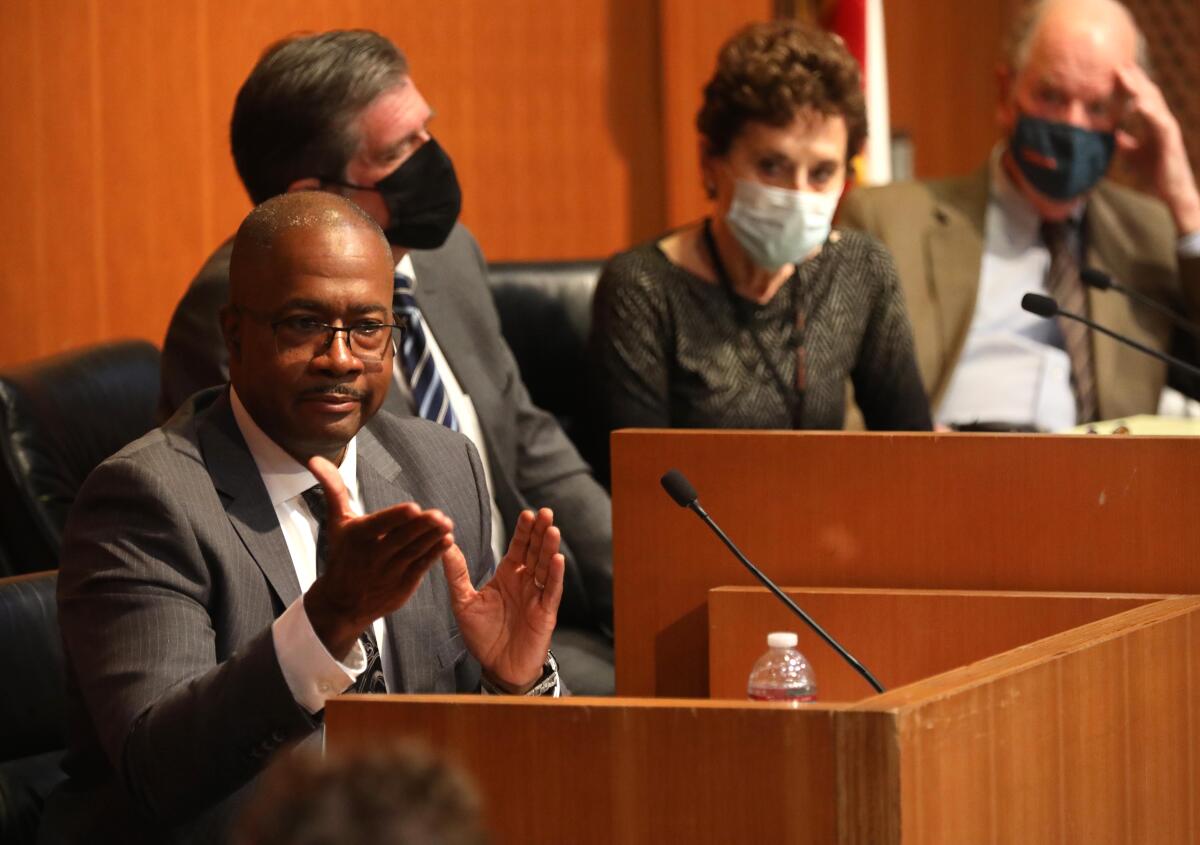 A man in a witness box in a courtroom