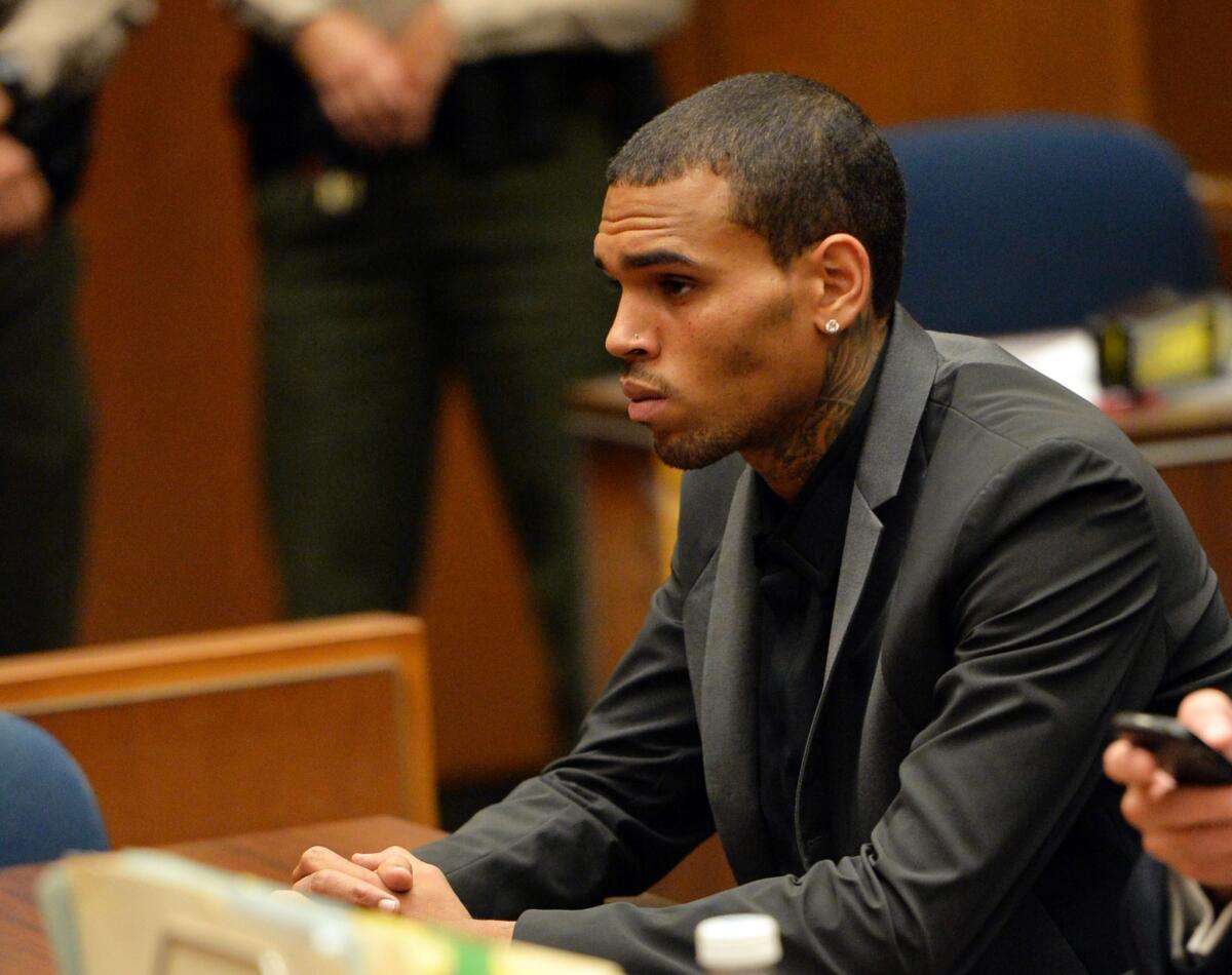 Chris Brown appears at a hearing in Los Angeles County Superior Court. Prosecutors said the decision to drop certain charges in an alleged hit-and-run won't influence their pursuit of probation violation against him.