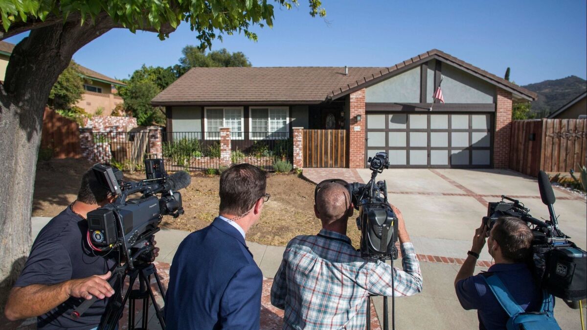 Journalists wait outside of the home of shooter Ian David Long in Thousand Oaks.