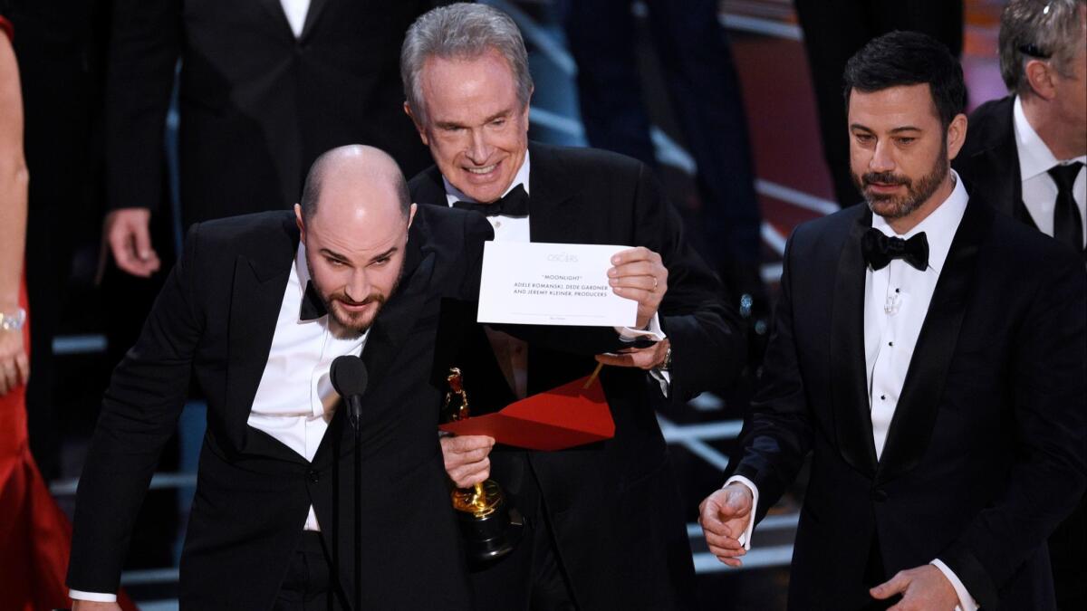 Jordan Horowitz, producer of "La La Land," left, shows the envelope revealing "Moonlight" as the true winner of best picture at the 2017 Oscars.