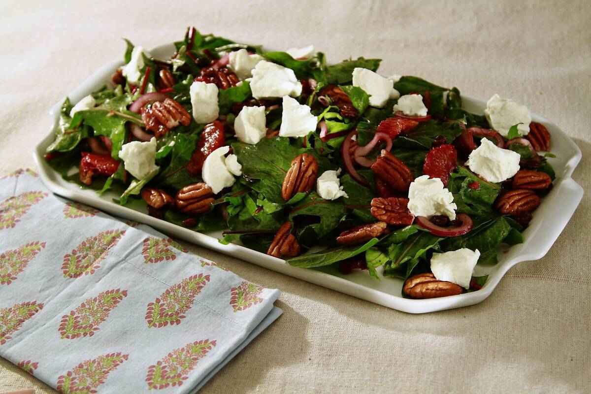 Dandelion greens are complemented with blood oranges, goat cheese and pecans in a salad with a bit of bite.