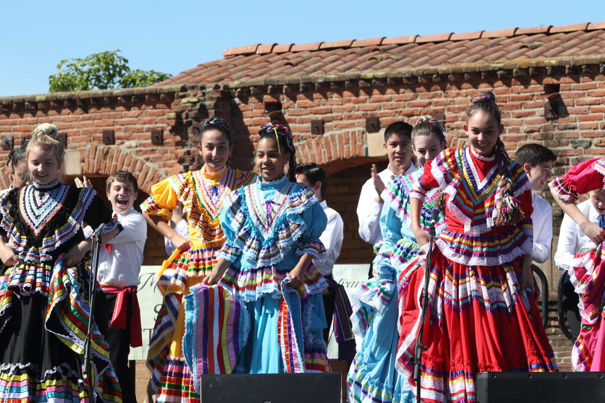 Children participate in Return of the Swallows festivities at Mission San Juan Capistrano in March 2022.