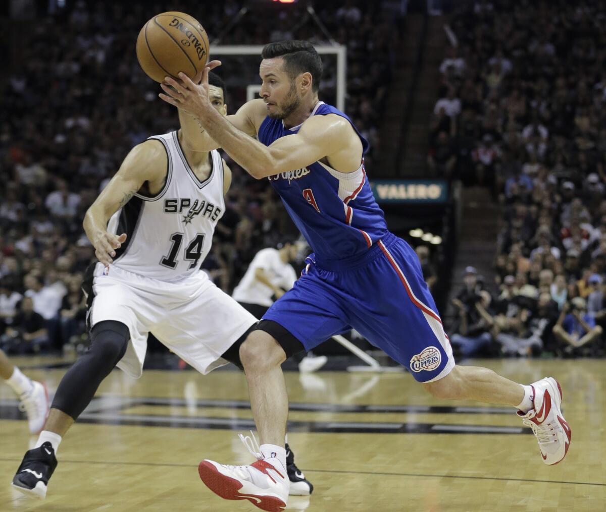 J.J. Redick drives around San Antonio's Danny Green on April 26.