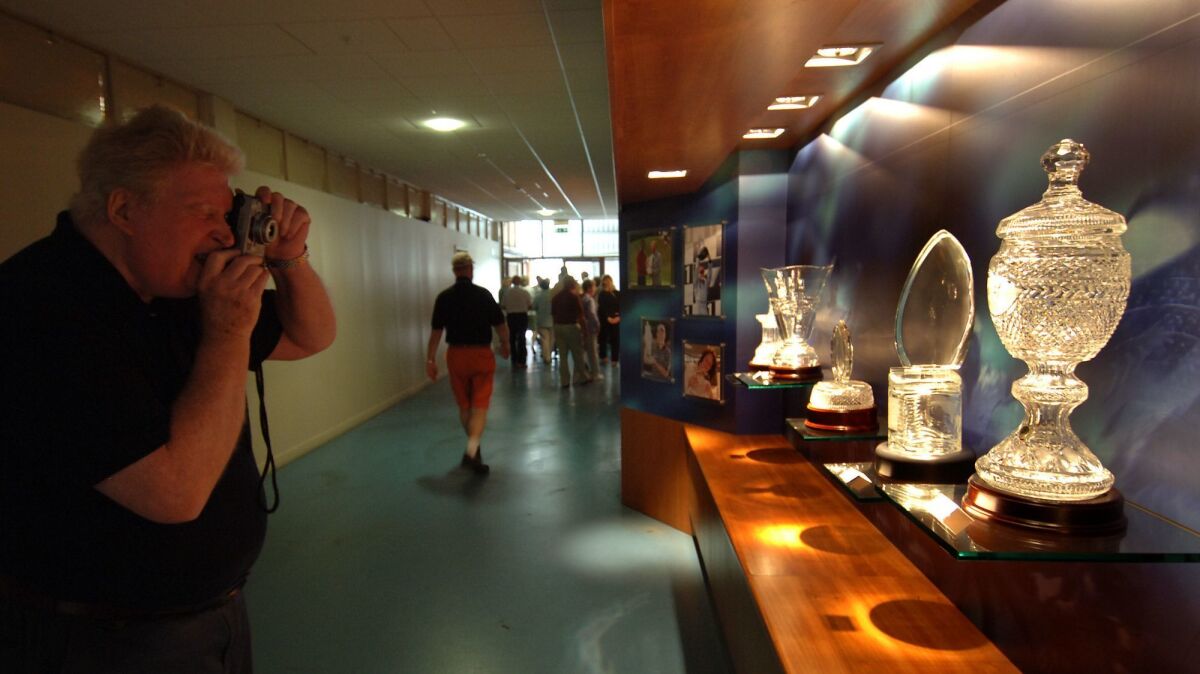 A visitor photographs some of the trophies Waterford makes for some of the most important sporting events worldwide.
