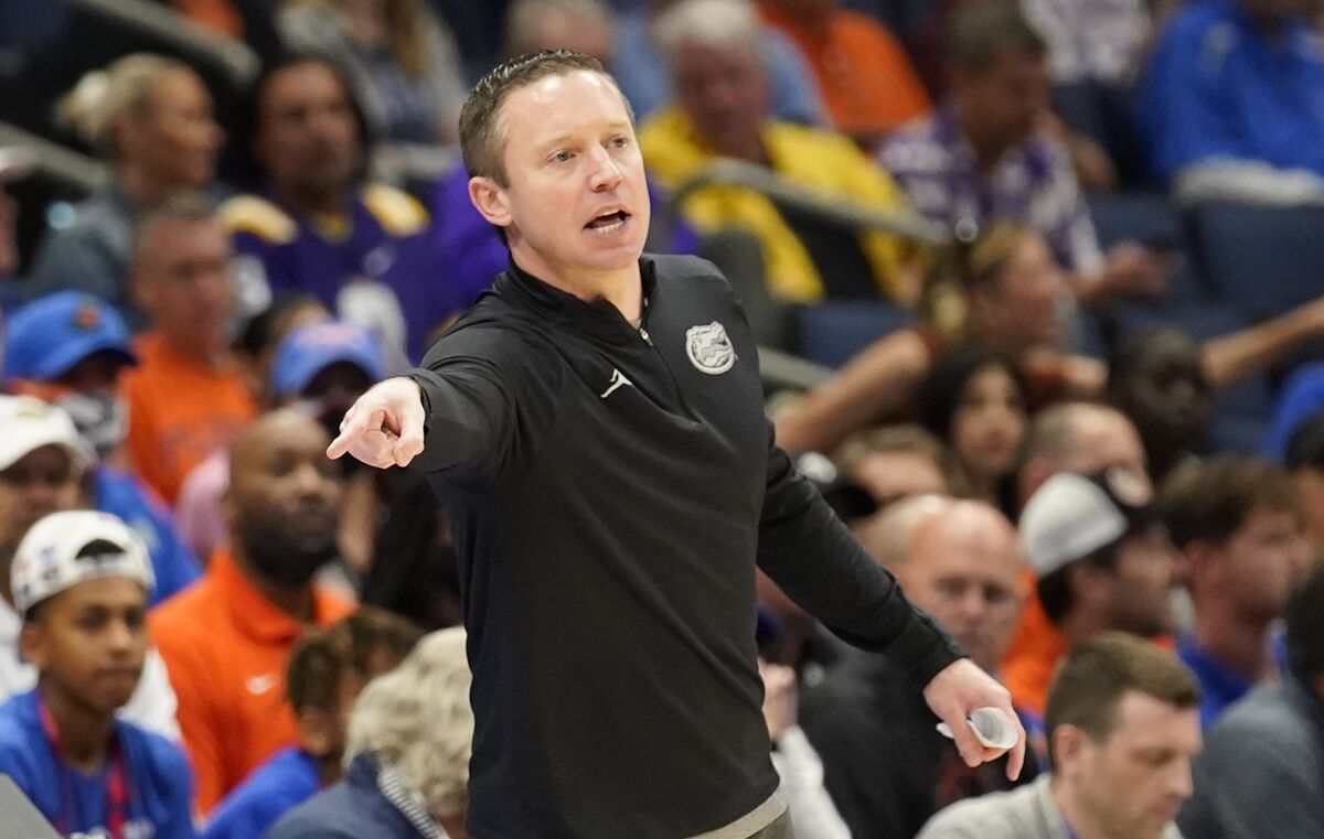 Florida head coach Mike White directs his players during the second half of an NCAA men's college basketball game against Texas A&M at the Southeastern Conference tournament in Tampa, Fla., Thursday, March 10, 2022. (AP Photo/Chris O'Meara)