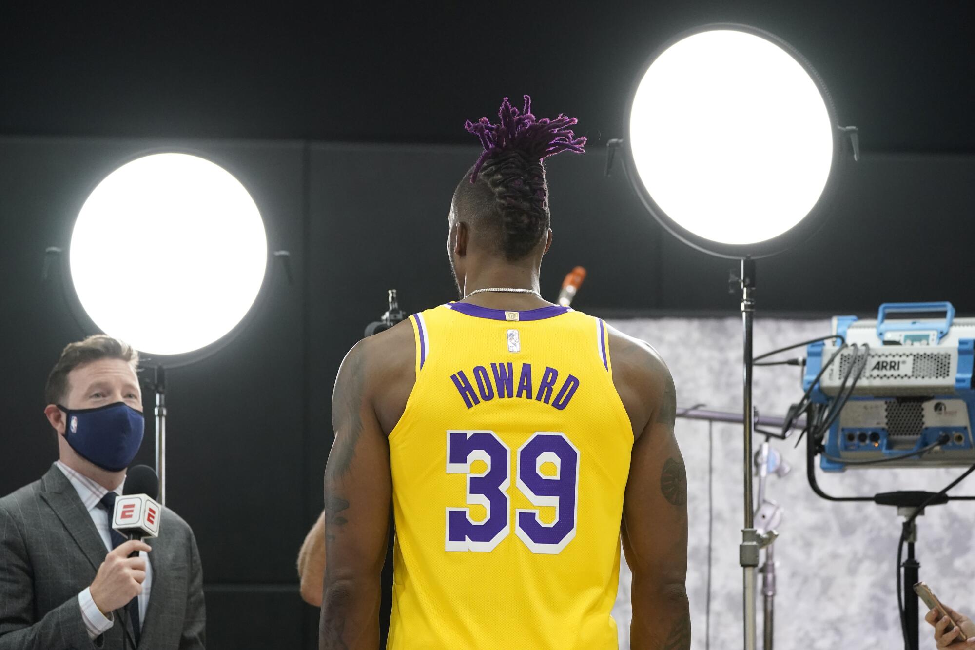 Los Angeles Lakers center Dwight Howard answers questions during the NBA basketball team's Media Day.