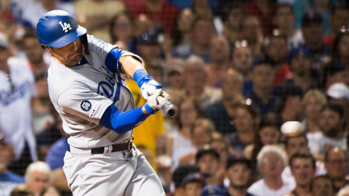 A.J. Pollock hits a run-scoring single during the fifth inning of the Dodgers' 7-4 victory over the Boston Red Sox on Sunday.