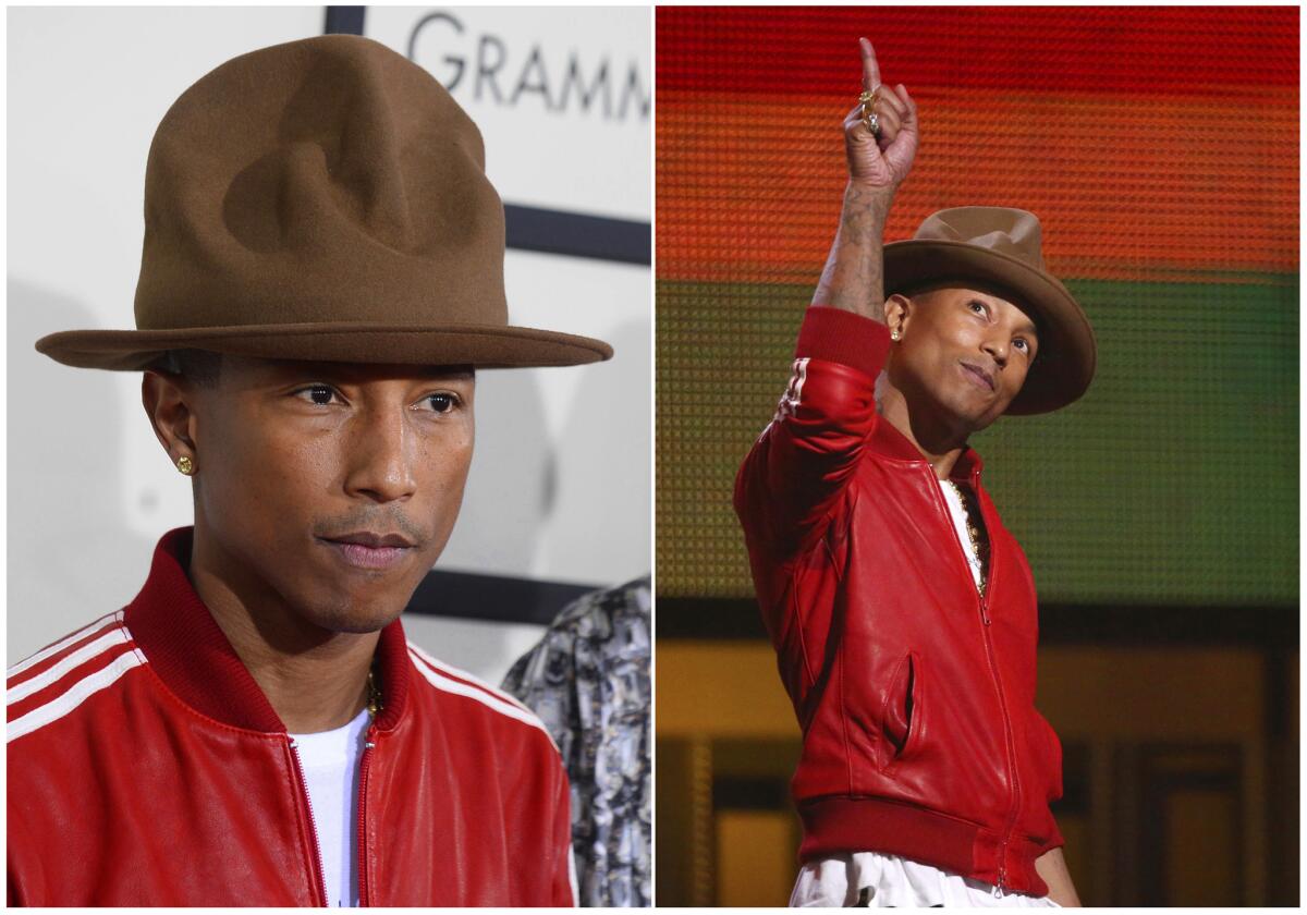 Pharrell Williams in his Vivienne Westwood Canadian Mountie hat at the 56th annual Grammy Awards, where he won four Grammys, including album and record of the year.