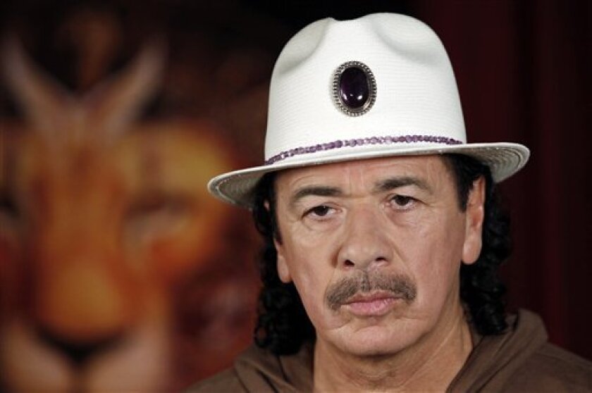 Musician Carlos Santana is seen during an interview in Los Angeles on Wednesday, April 1, 2009. (AP Photo/Matt Sayles)