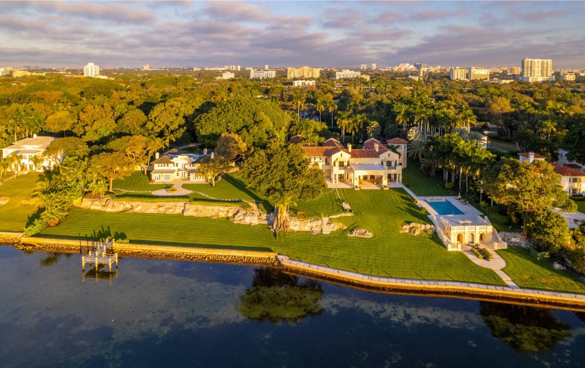 Waterfront mansions are seen in from the air.
