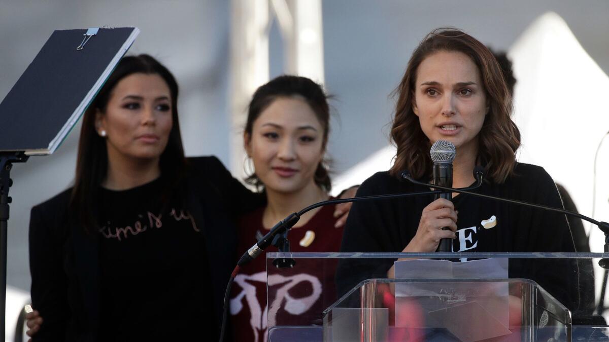 Actress Natalie Portman, right, opens the 2018 Women's March in Los Angeles with Eva Longoria, left, and Constance Wu.