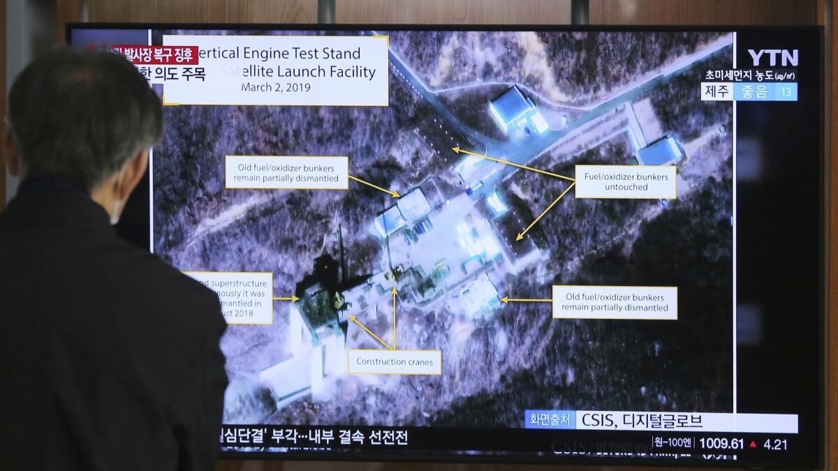 A TV screen at a South Korean railway station on March 6, 2019, shows rebuilding work at North Korea's largest missile engine test site.