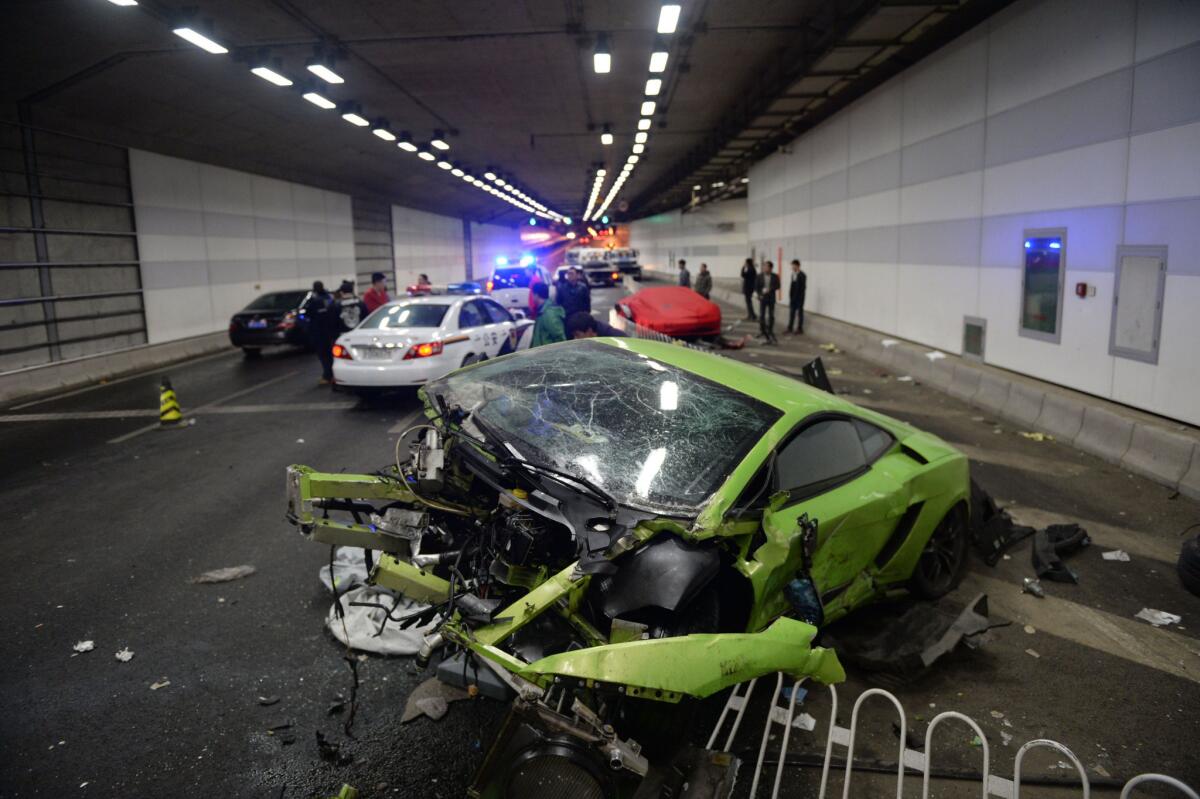 A badly damaged Lamborghini is shown in a Beijing tunnel after a spectacular crash involving a Ferrari on April 12.