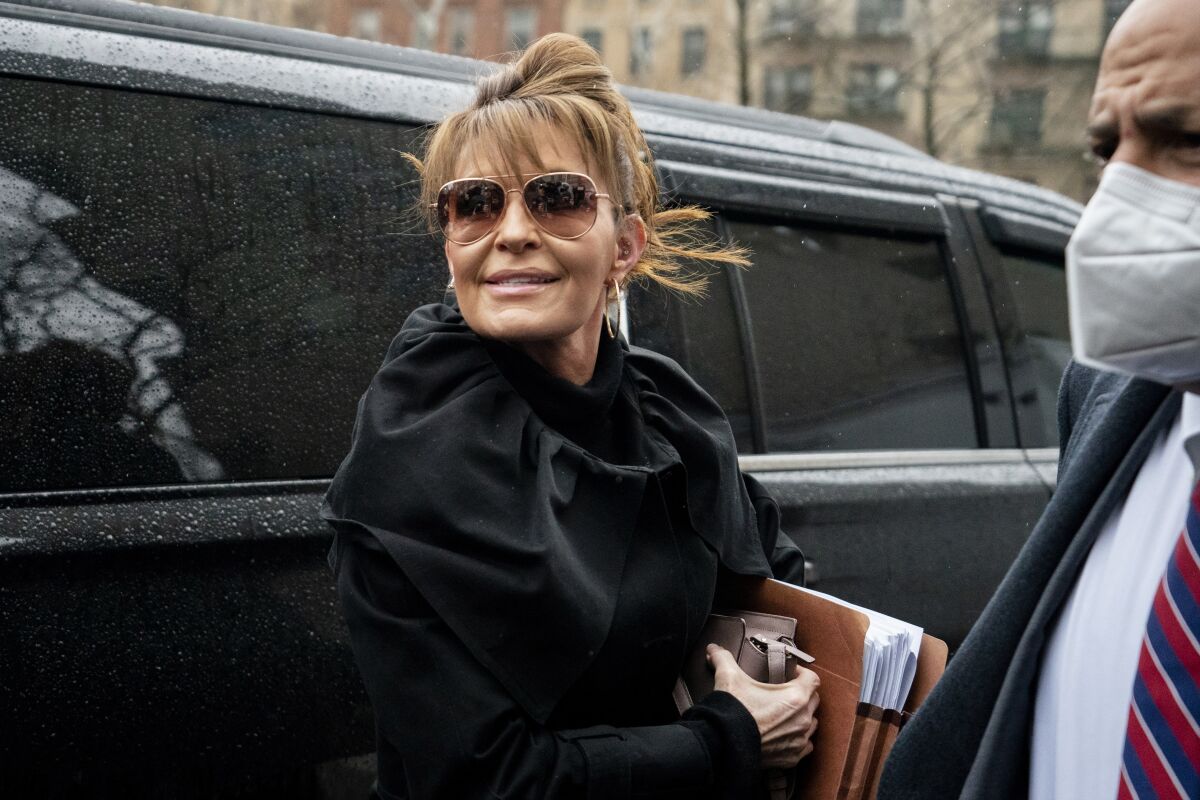 Former Alaska Gov. Sarah Palin arrives to Federal court, Thursday, Feb. 3, 2022, in New York. Palin is due back in a New York City courtroom more than a week after her libel trial against The New York Times was postponed because she tested positive for COVID-19. (AP Photo/John Minchillo)