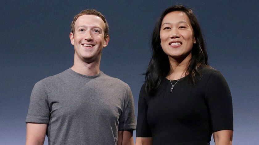 Facebook CEO Mark Zuckerberg and his wife, Priscilla Chan.