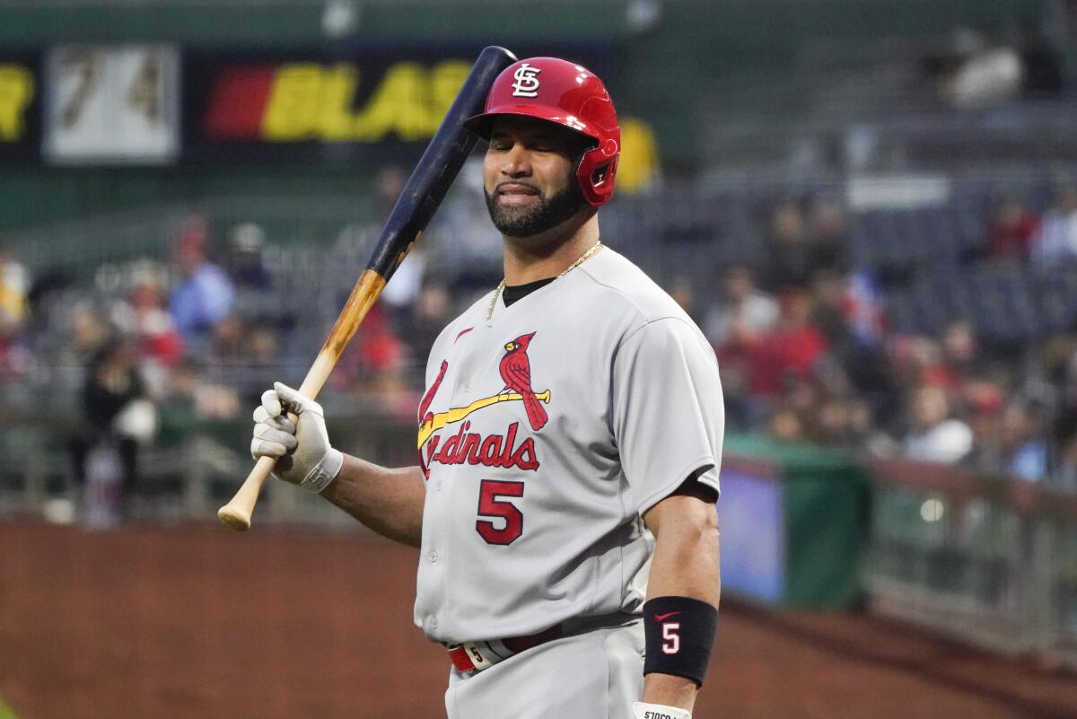 Los Angeles Angels' Albert Pujols adjusts his glove before the