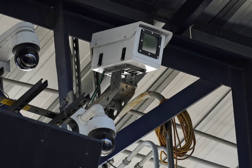 One of the cameras used for automatic balls and strike calls is shown during the first inning of a Low A Southeast league baseball game between the Dunedin Blue Jays and the Tampa Tarpons at George M. Steinbrenner Field Tuesday, May 4, 2021, in Tampa, Fla. The game is one of the first in the league to use automatic calls. (AP Photo/Chris O'Meara)