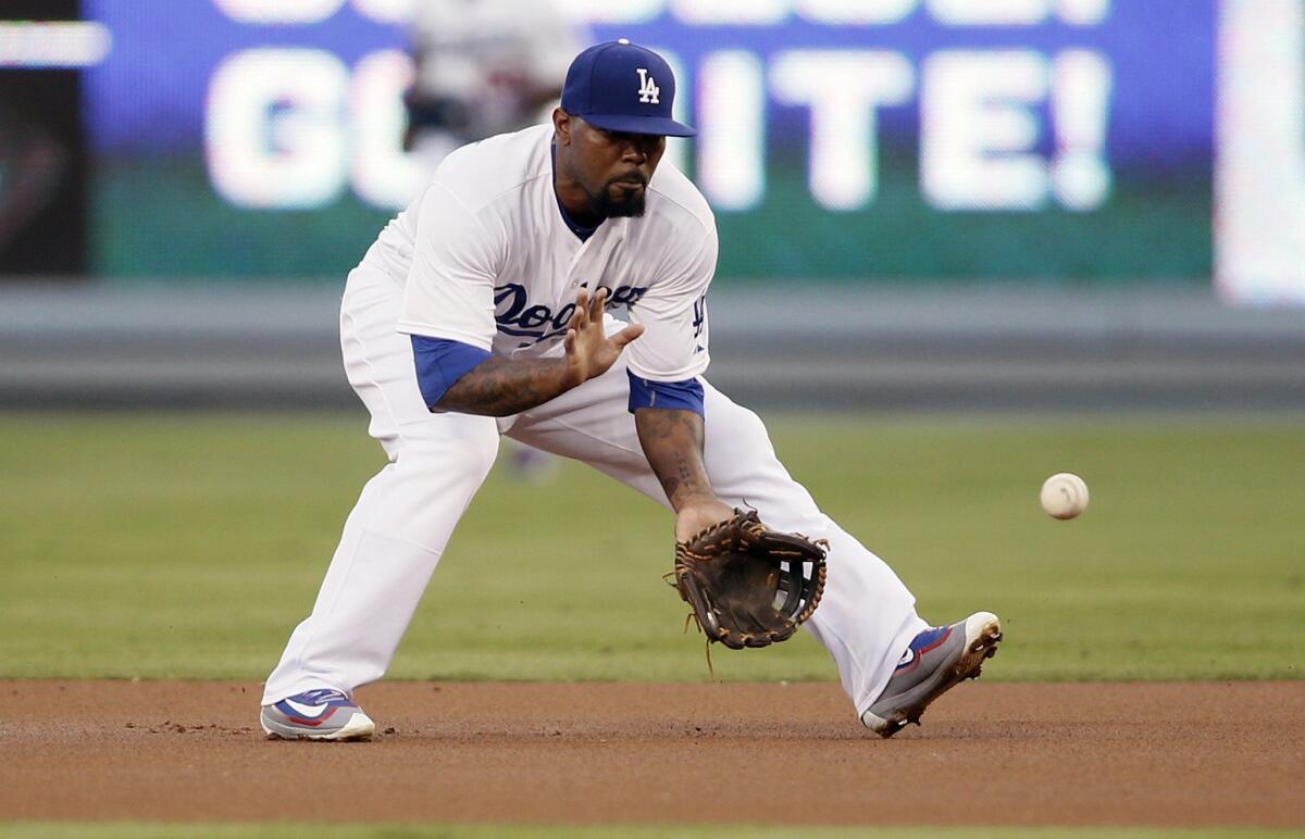 Howie Kendrick fields a ground ball during a game against the San Diego Padres at Dodger Stadium on Oct. 3, 2015.