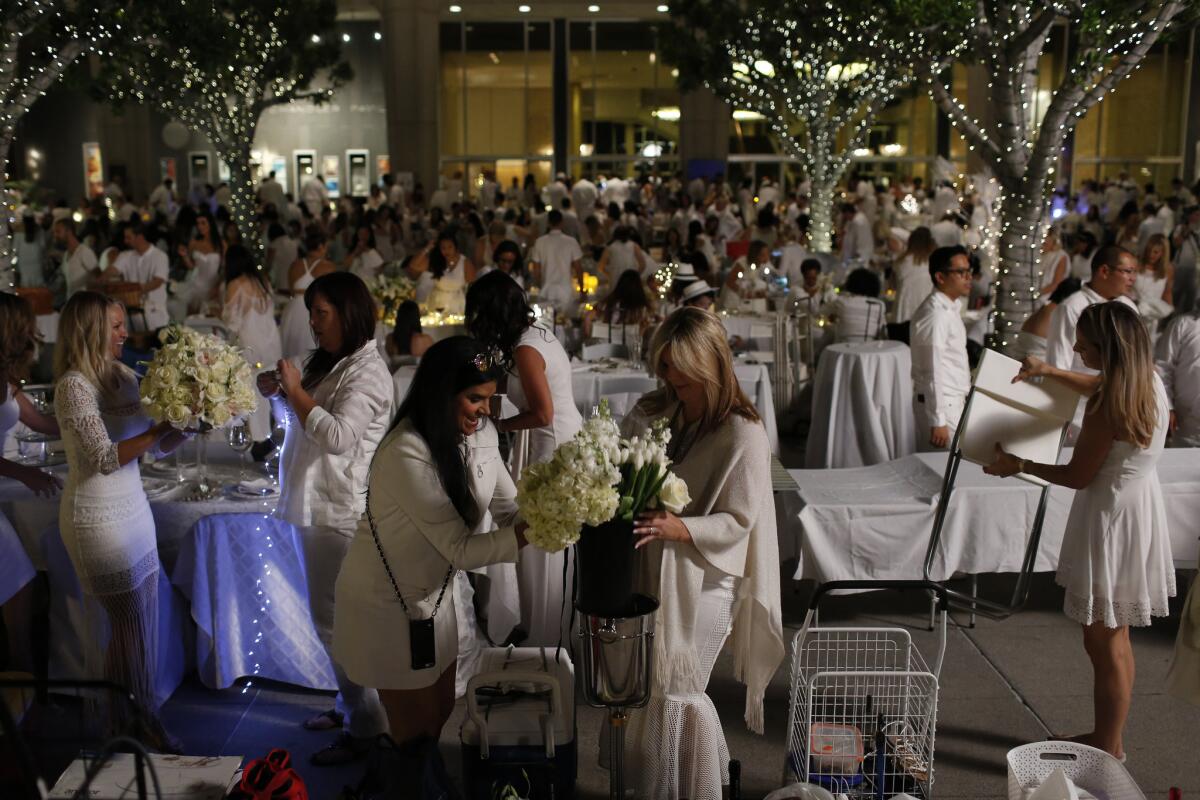 People set up their own tables and chairs at Dinner en Blanc.