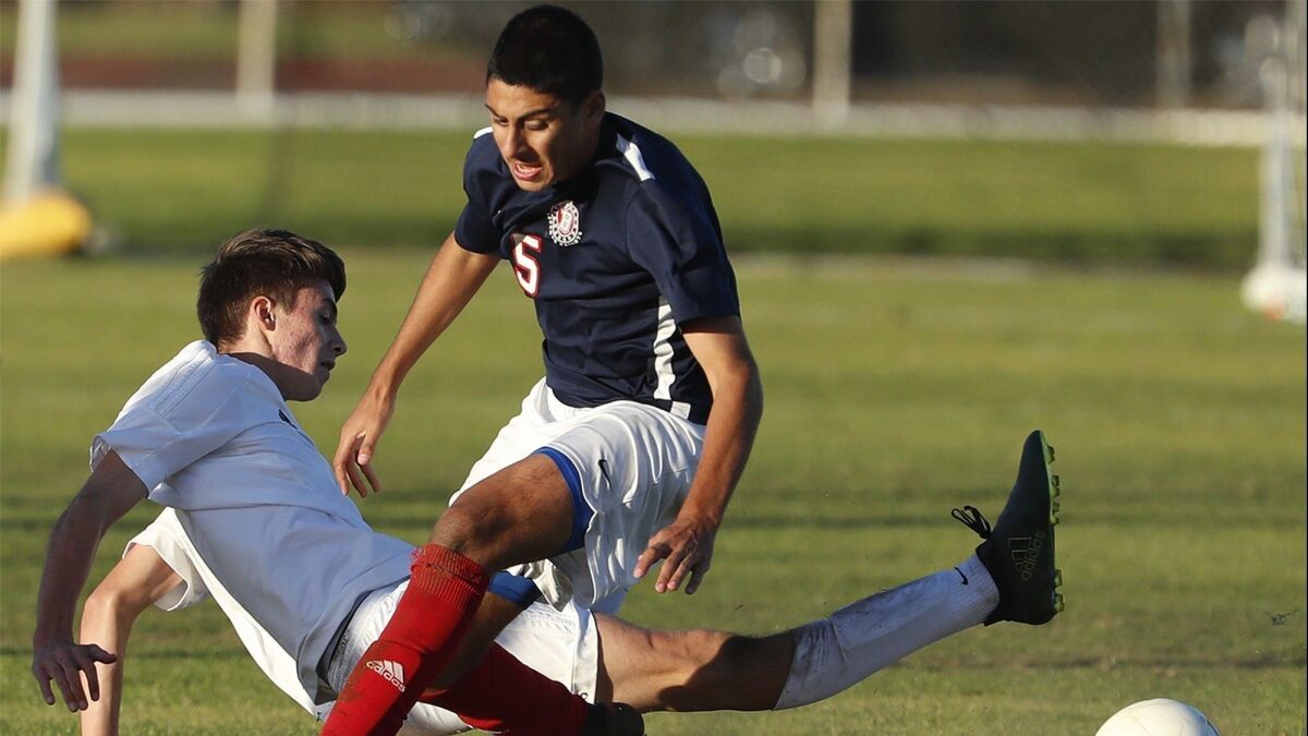 Corona del Mar High's Niko Urban, pictured on the ground against Beckman on Jan. 25, scored a goal in the Sea Kings' 3-0 win at JSerra on Monday.