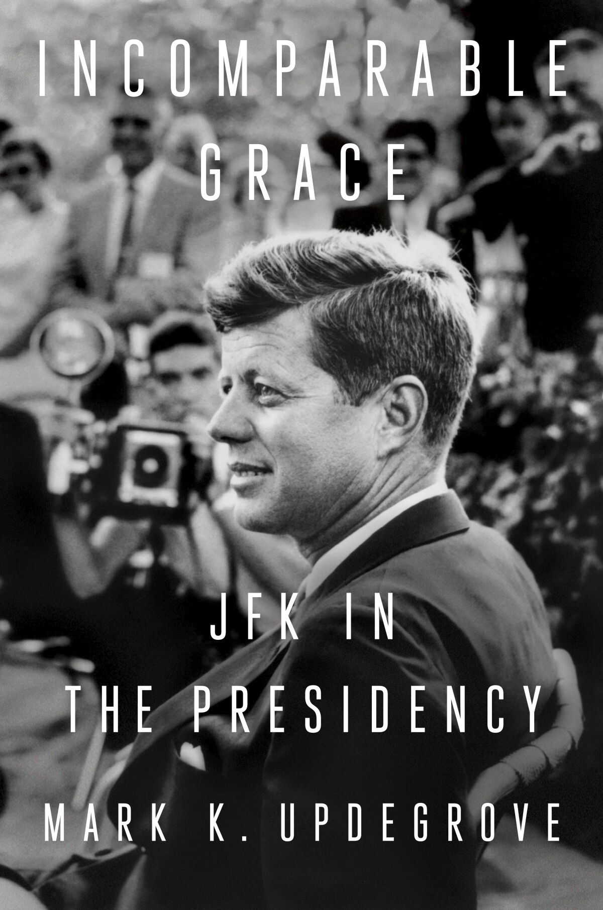 This cover image released by Dutton shows "Incomparable Grace: JFK in the Presidency" by Mark K. Updegrove. (Dutton via AP)