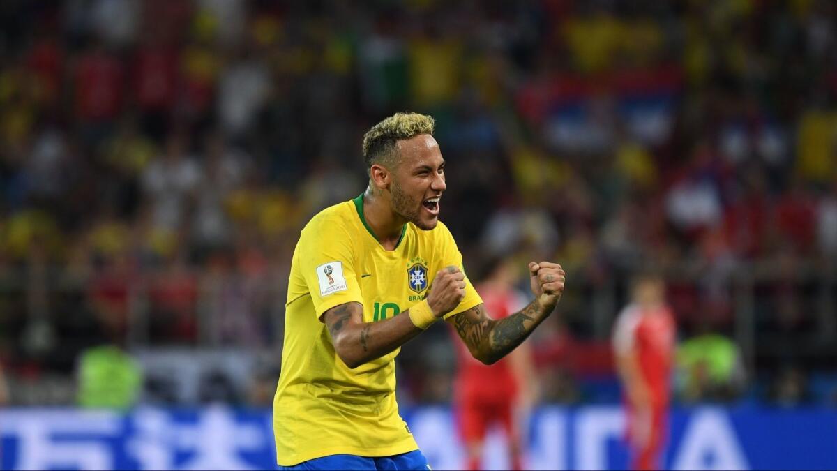 Neymar celebrates following Brazil's 2-0 World Cup victory over Serbia on June 27.