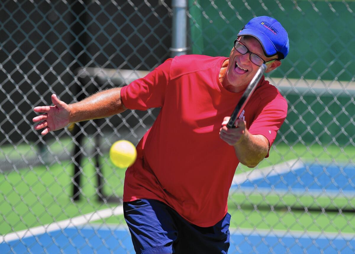 Pickleball champion Ford Roberson practices in Denton, Texas. The game has gone from its goofing off with the kids origins to a fast-growing sport that draws all ages.