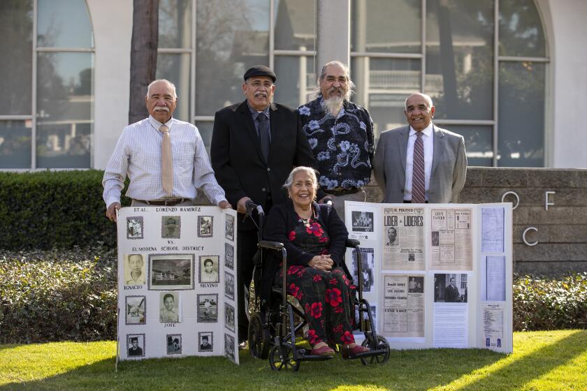 Antonio Ramirez, left, Michael Ramirez, MaryHelen Torres, Henry Ramirez and Lorenzo Ramirez Jr. pose for a photo in front of Orange City Hall on Tuesday, February 8.